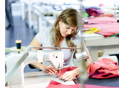 Woman using an industrial sewing machine