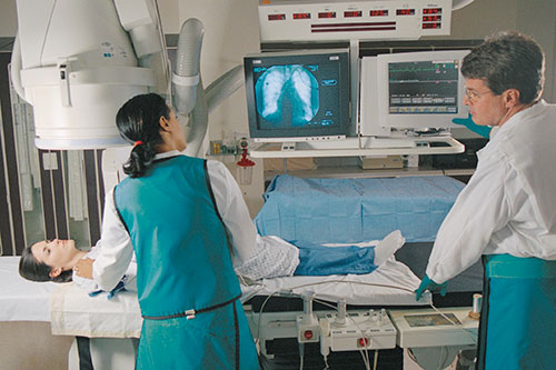 Technicians take an image of a patient