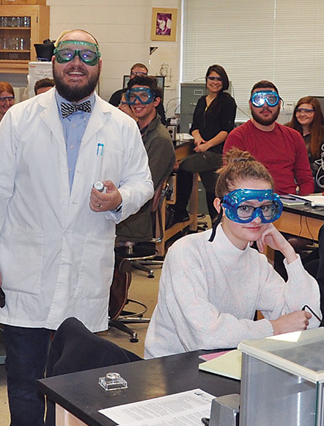 Instructor and students in a science lab