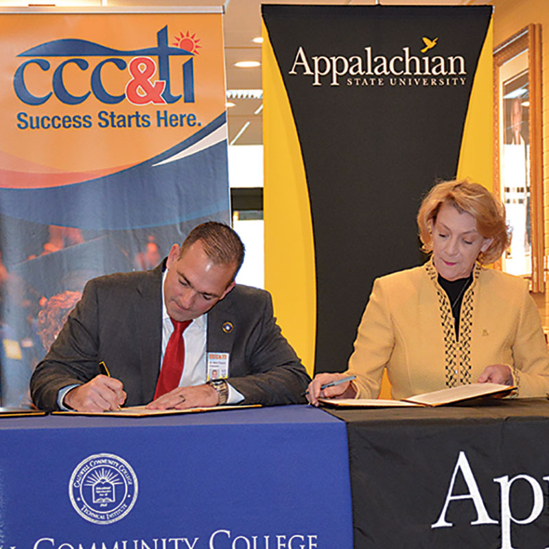 Dr. Poarch signing Co-Admission agreement with ASU