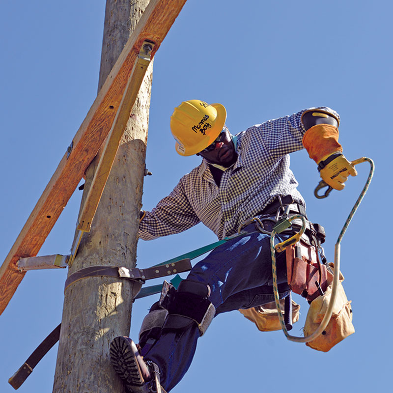 Electrical Lineman on a power pole