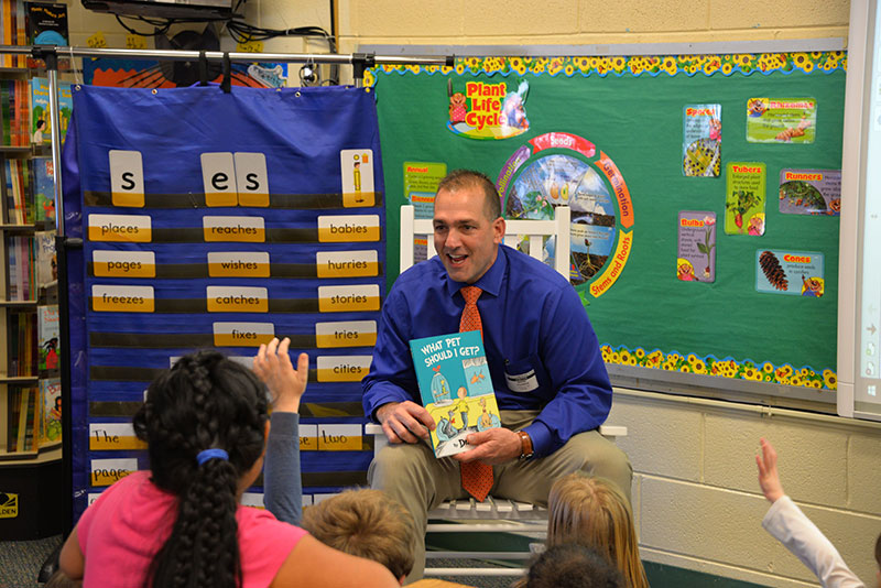 Dr. Mark Poarch Reading to Students