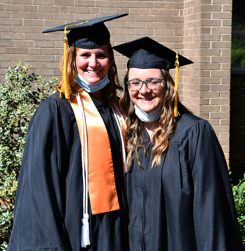 Mother and daughter, Cynthia Smith and Katelyn Anders, celebrate their graduation.