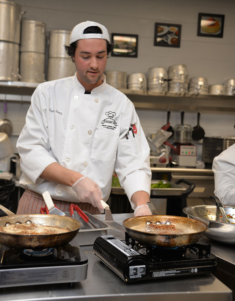 CCC&TI Culinary Arts student Hunter Sharp prepares 
                                	Food in the Culinary Arts kitchen on the Watauga Campus. 