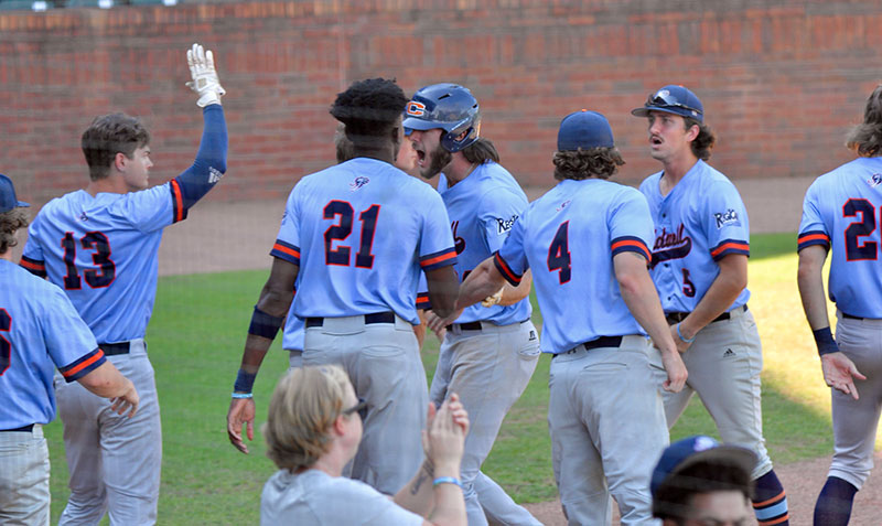 Hayden Stezer celebrates with the team after scoring the go ahead run